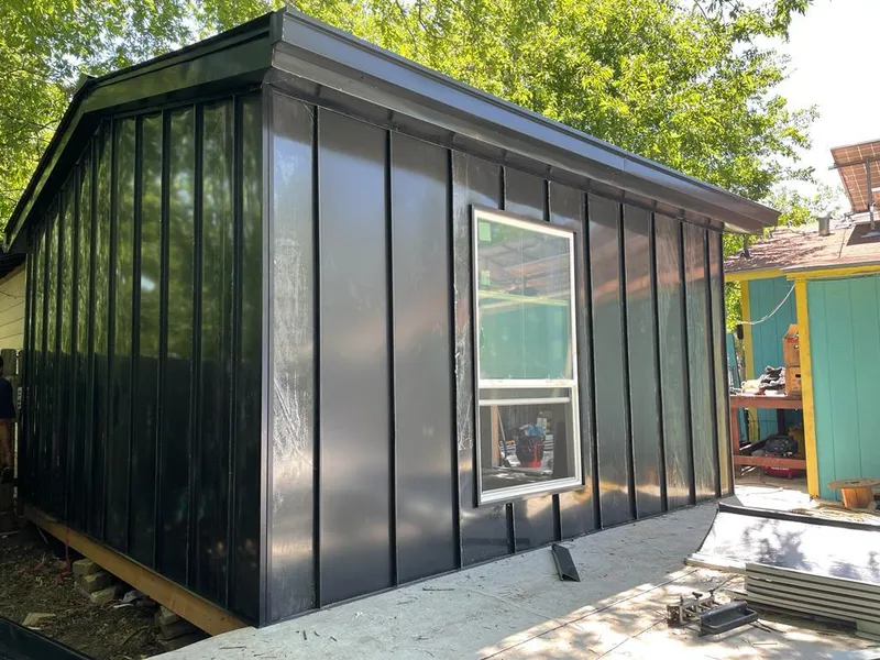 Black standing seam metal wall panels for Roof Inspection in Madison Heights