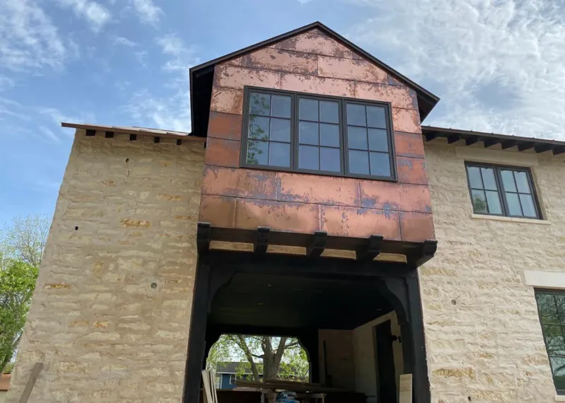 Copper metal panel facade on a stone building for Metal Roof Coating in Madison Heights